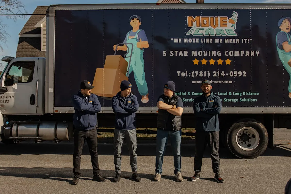 Move and Care crew standing in front of a branded box truck