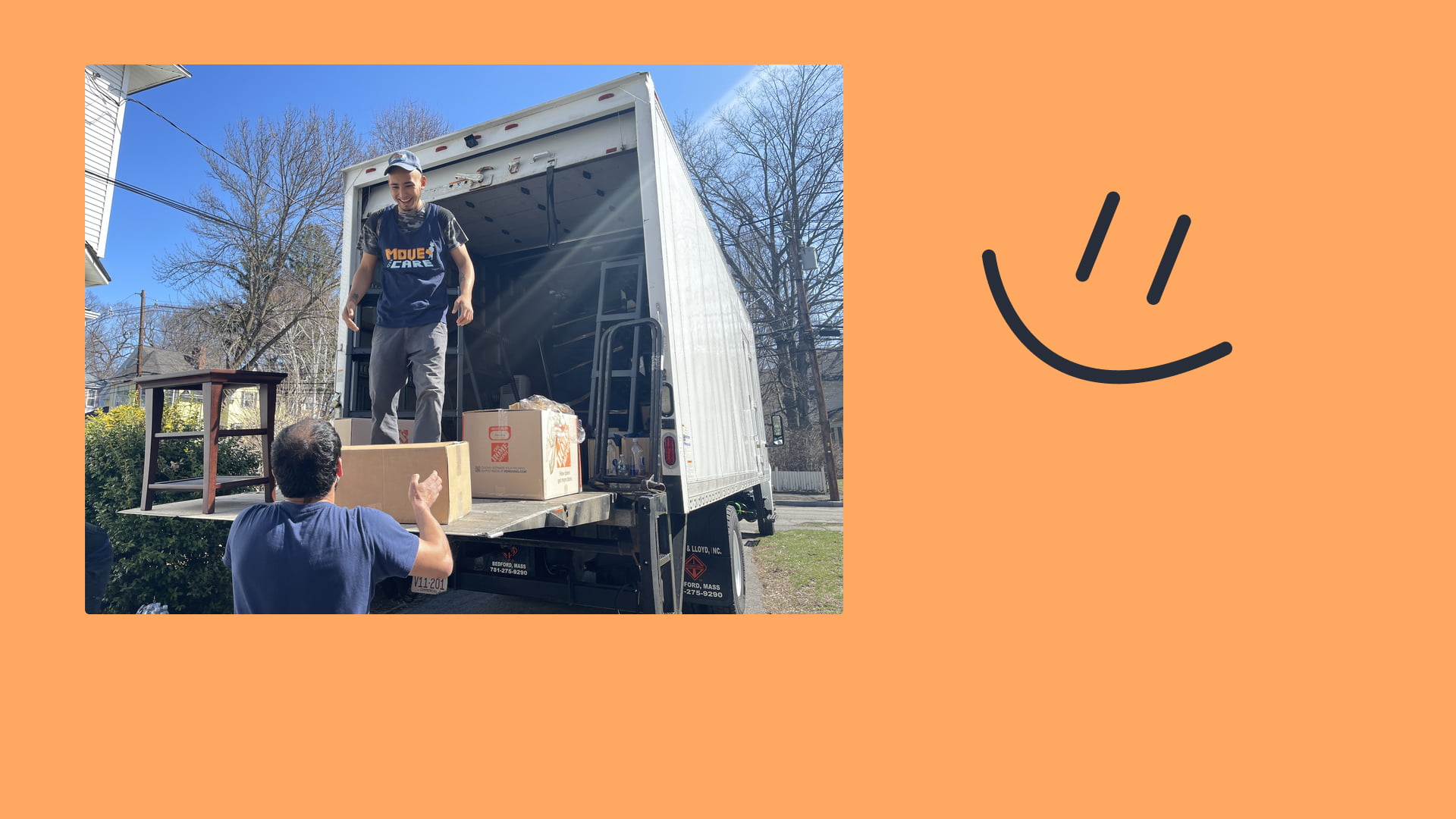 Happy movers loading a truck.