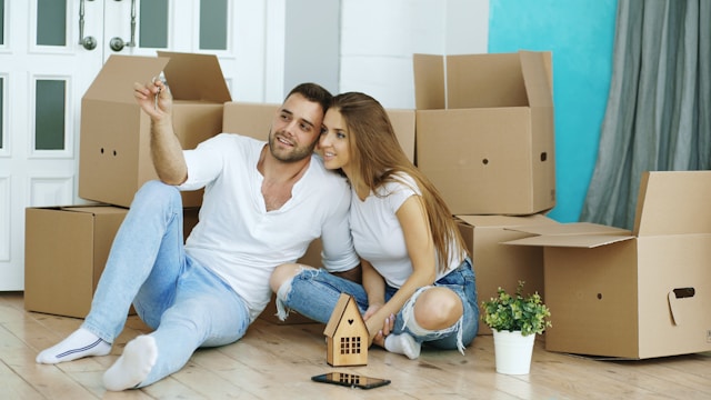 Couple surrounded by moving boxes